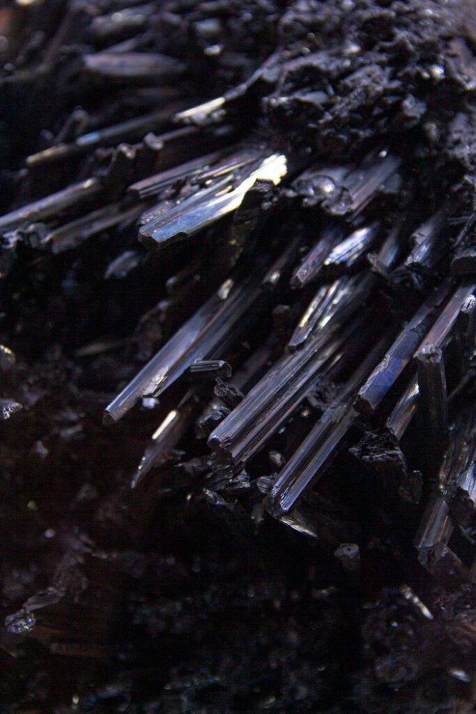 Close-up view of dark crystal formations displaying rough textures and natural mineral beauty.